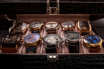 storage box with collection of men wrist watches