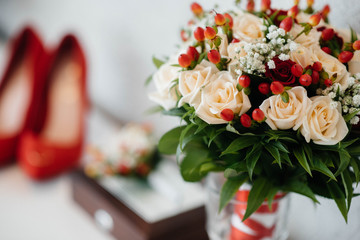 Wedding rings and other accessories close-up during the bride's gathering. Wedding