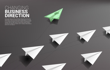 money banknote origami paper airplane going out from group of white. Business Concept of disruption and vision mission.