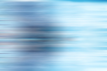 Abstract cold blue background with motion blur. Blurred background texture.