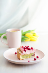 breakfast with flowers tulips, cake, tea, coffee in a pink mug on a light background. holiday morning on Valentine's Day, March 8, mother's day, birthday. vertical, soft focus