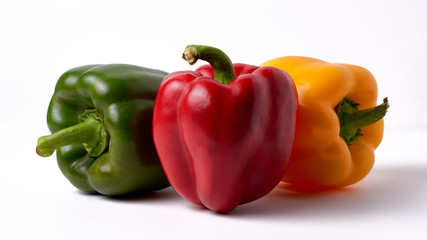 red, yellow ,green, sweet bell pepper or capsicum isolated on white background