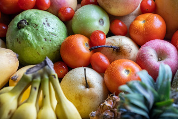 Mix fresh fruits on the table close up view. Selective focus.