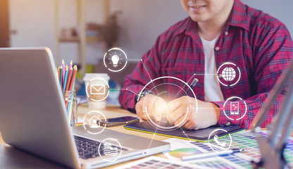 working at home self-quarantine staying safe from coronavirus COVID-19 pandemic concept, close up graphics designer photographer using tablet pen and laptop computer working on project in home office