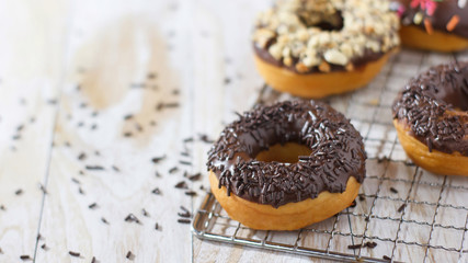 A donut on a white wooden table