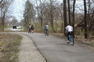 Two walkers and two cyclists on the North Branch Trail at LInne Woods in Morton Grove, Illinois