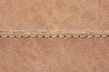 Brown leather texture with a linear stitch