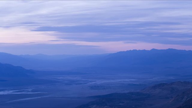 A long-lens timelapse of beautiful pink and purple light over the Mojave Desert and the Grapevine and Funeral Mountain Ranges.