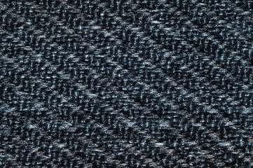 Black fabric texture. knitted textile macro. woven background
