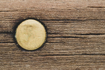 Fototapeta na wymiar Wooden background with a dowel. wood texture with a metal pin