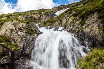Fototapeta na wymiar Low Angle View Of Waterfall On Mountain