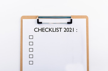"CHECKLIST" concept. Note pad and white paper on white background, copy space