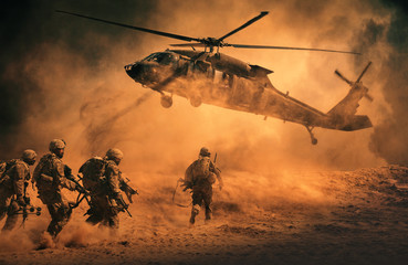 Fototapeta na wymiar Military soldiers are running to the helicopter in battlefield