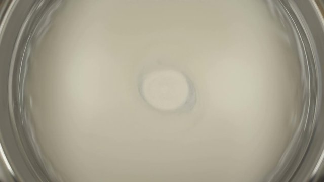 Rheoscopic fluid. Beautiful movement of particles in a liquid. Fantastic patterns and shapes.