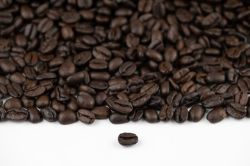 Roasted coffee beans texture pattern on white background