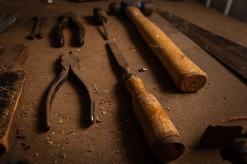 Close up of old vintage woodworking tools on the bench