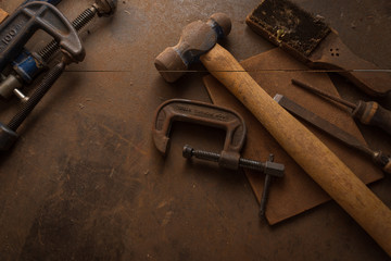 Background with collection of vintage tools on bench