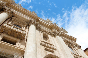 Facade decoration with big column and sculptures of St. Peter's Basilica in Vatican City, Rome, Italy