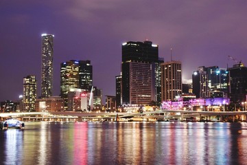 Fototapeta na wymiar Brisbane River Against Illuminated Modern Buildings At South Bank
