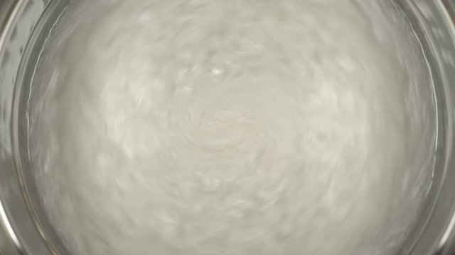 Rheoscopic fluid. Beautiful movement of particles in a liquid. Fantastic patterns and shapes.