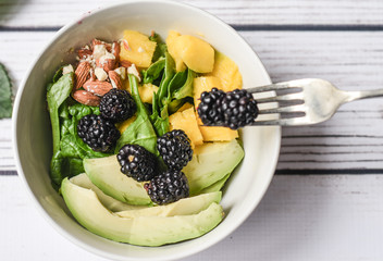 Fresh summer salad with berries and mango
