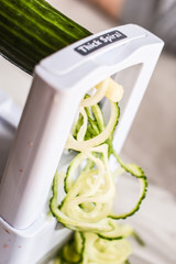 Spiraled vegetable being cut 