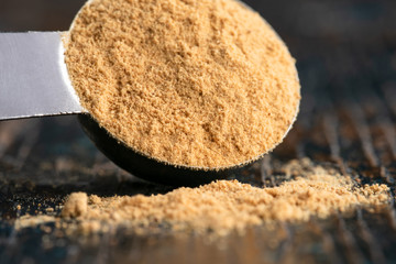 Ground Ginger Spilled from a Teaspoon