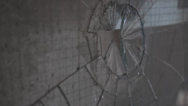 Broken Glass At Window Inside The Abandoned Building.-closeup shot