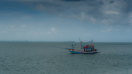 Traditional Thai fishing boat with outriggers out