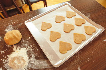 Glazed heart shaped cookies for Valentine's day - delicious homemade natural organic pastry, baking with love for Valentine's day, love concept