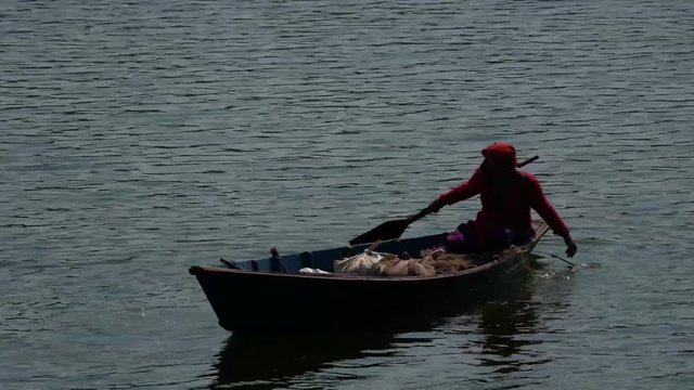 Lady Fisher on her Boat on Begnas Lake, Pokhara Nepal