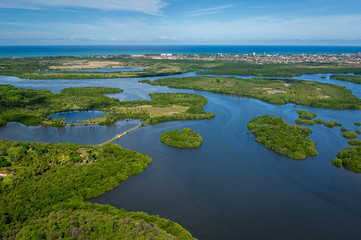 Santa Cruz channel, south of the island of Itamaraca, near Recife, Pernambuco, Brazil on March 1, 2014. Forests, mangroves and coconut trees between the river, forming small islands. Aerial view