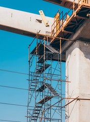 The temporary staircase was built for the construction with prevent falling. scaffolding in the...