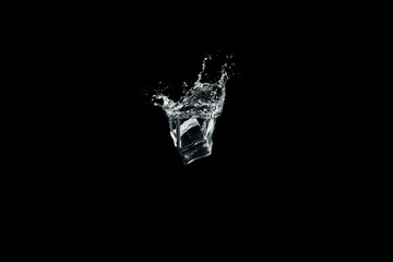 ice cubes drop to water, isolated with black background