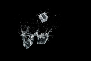 ice cubes drop to water, isolated with black background