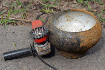 19th century cast-iron kitchen pot. It was distributed in the Russian Empire. Found with metal detector in Poltava Region, Ukraine. Cleaning with grinder brush