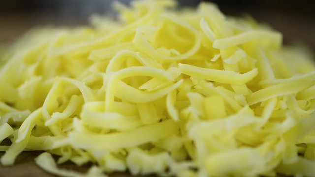 Portion of grated Cheese (seamless loopable; 4K)