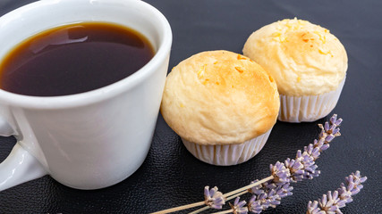 Black coffee and bakery in black background. Healthy breakfast. coffee lover