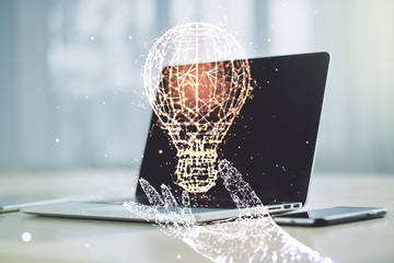 Double exposure of creative light bulb hologram on laptop background, research and development...