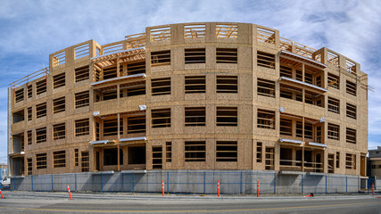 Wood framing of a new three story building at construction site