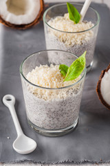 Chia pudding with coconut on a gray napkin.
