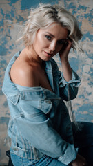 Fototapeta premium Fashion portrait of beautiful girl in jeans wear