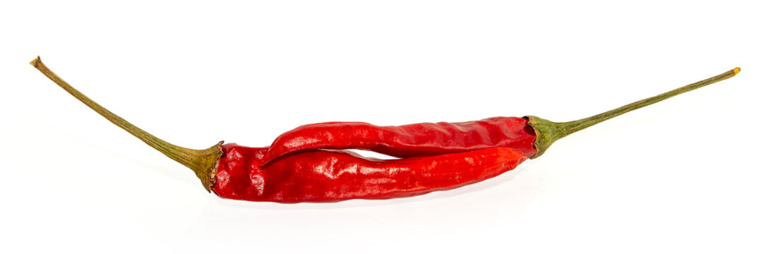 Dried red hot peppers isolated on white.