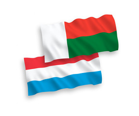 Flags of Madagascar and Luxembourg on a white background