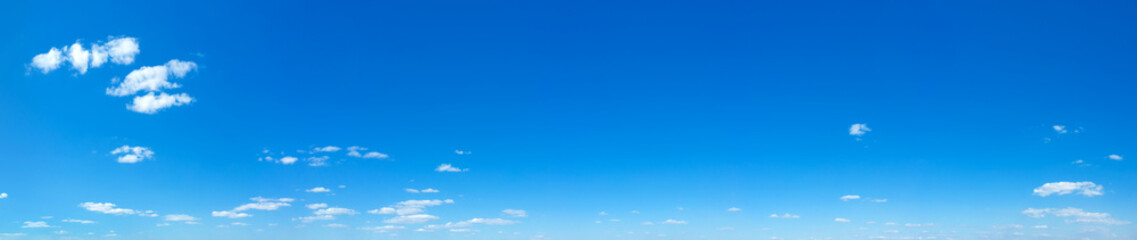 Blue Sky background with tiny Clouds. Panorama background