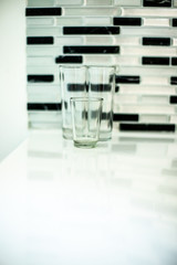 abstract shot of glasses in black and white wall background