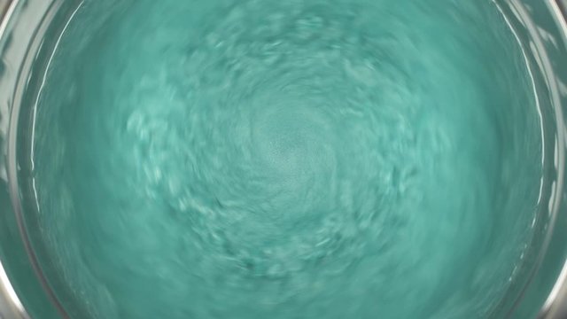 Rheoscopic fluid. Beautiful movement of particles in a liquid. Fantastic patterns and shapes.