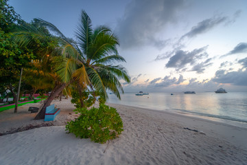 The amazing island of Omadhoo in the Maldives, with beautiful white sand beach and turquoise water.