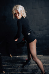 Naklejka premium Fashion portrait of beautiful, sexy girl in loft dark interior