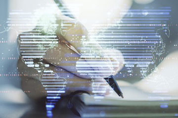 Double exposure of abstract digital world map and woman hand writing in notepad on background, big data and blockchain concept